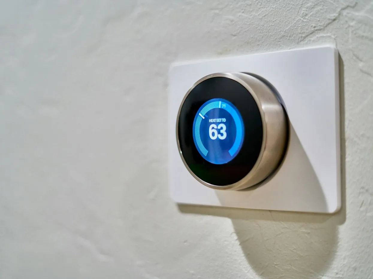 Smart thermostat and controls installed on a San Jose home wall